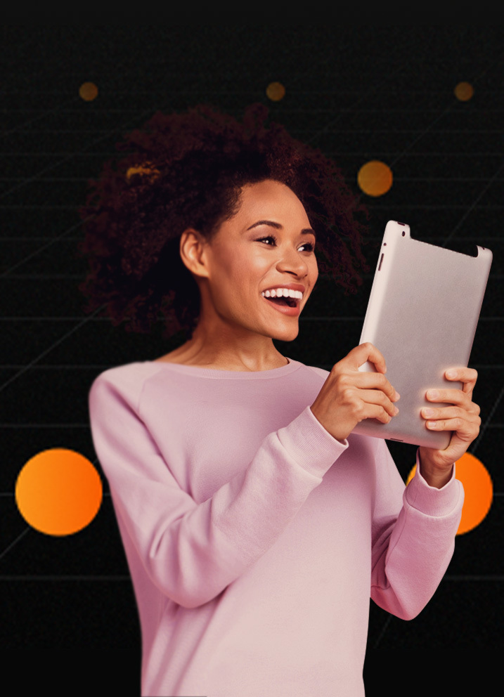 Smiling woman on tablet, black background with orange dots