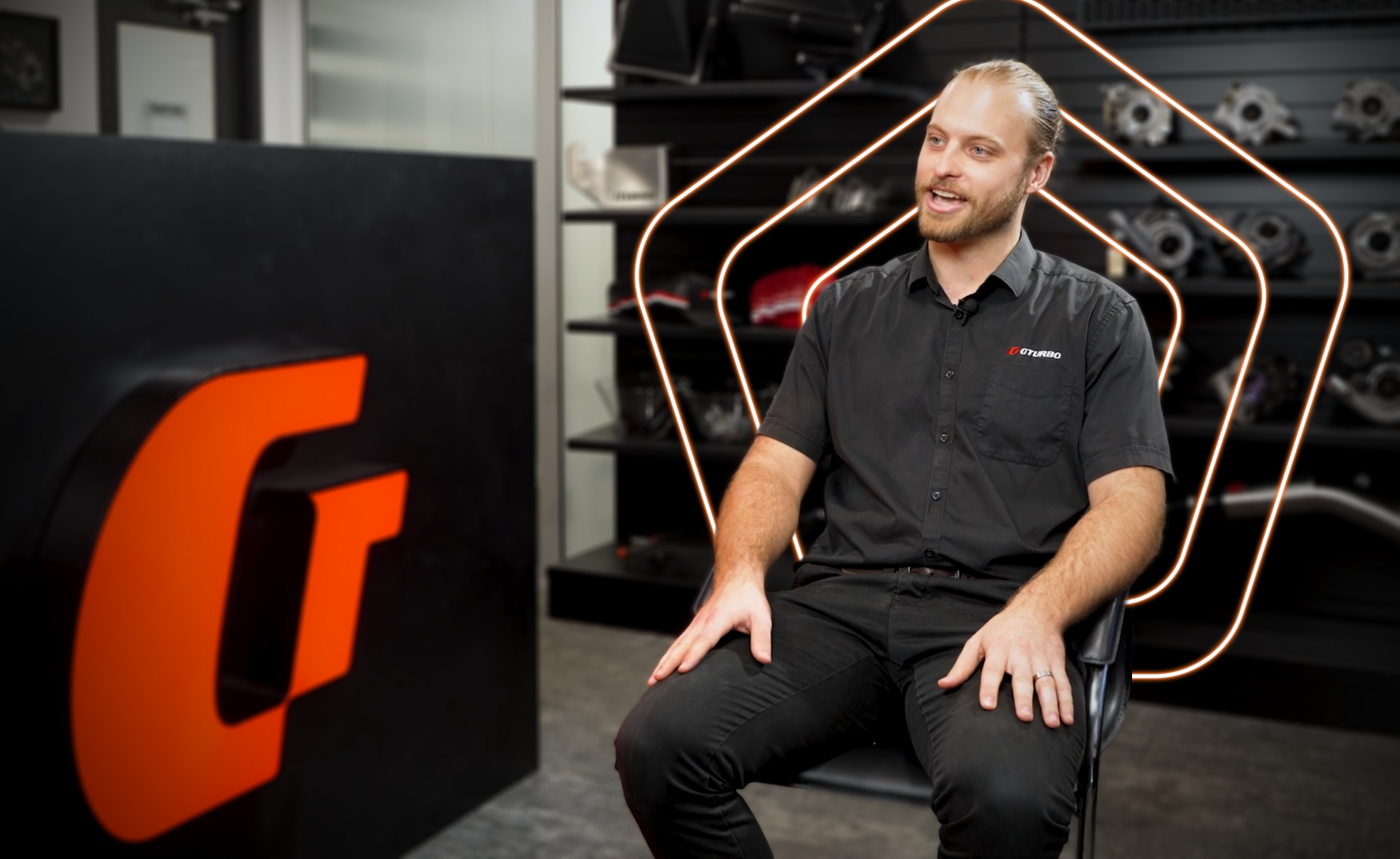 Man sitting in chair looking at camera